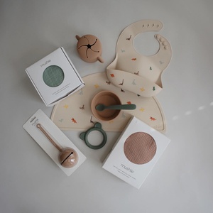 Bavoir silicone Mushie Dino