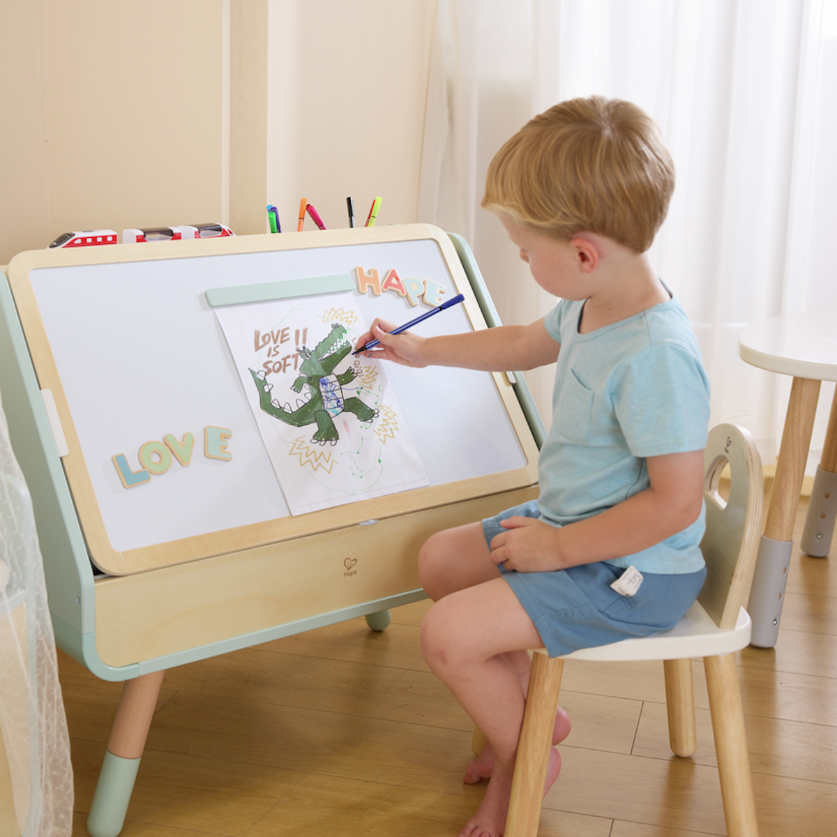 Tableau à dessins-bibliothèque 2 en 1 Hape